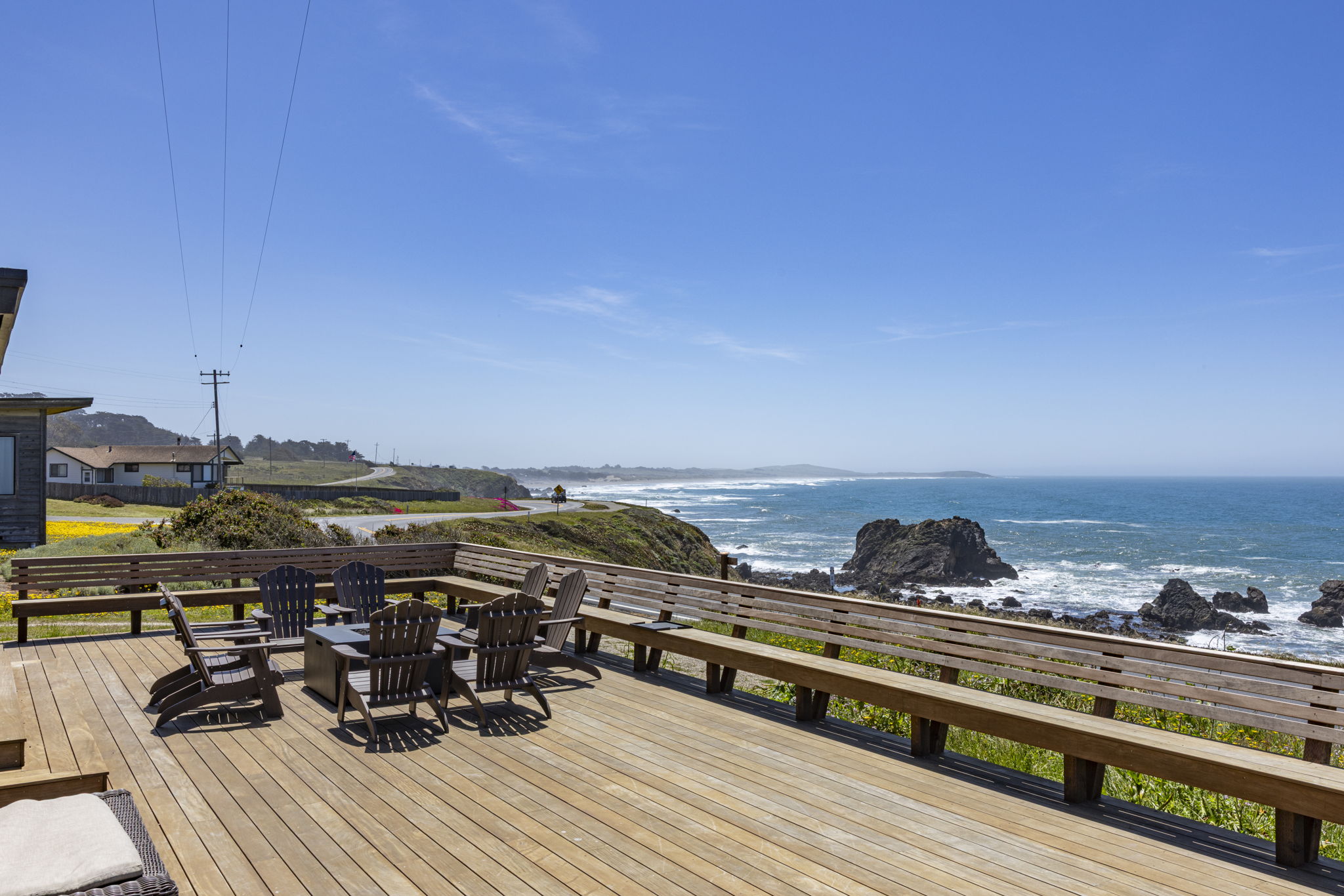 Ocean view deck with Adirondack chairs